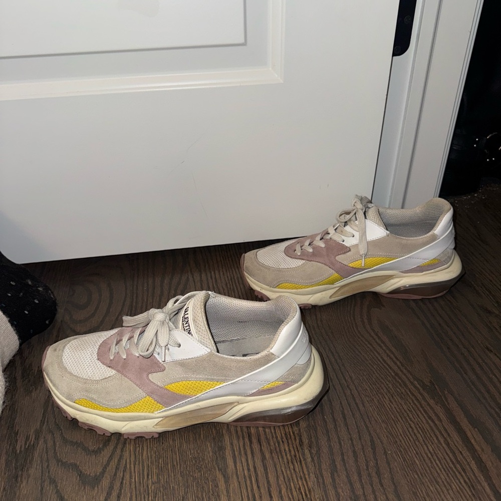 White pink, yellow, and gray Valentino sneakers